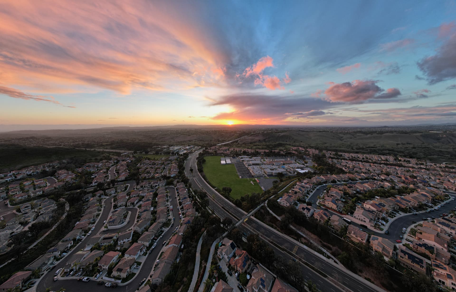 Las Flores neighborhoods, Antonio Parkway and Las Flores Middle School from the air at dusk